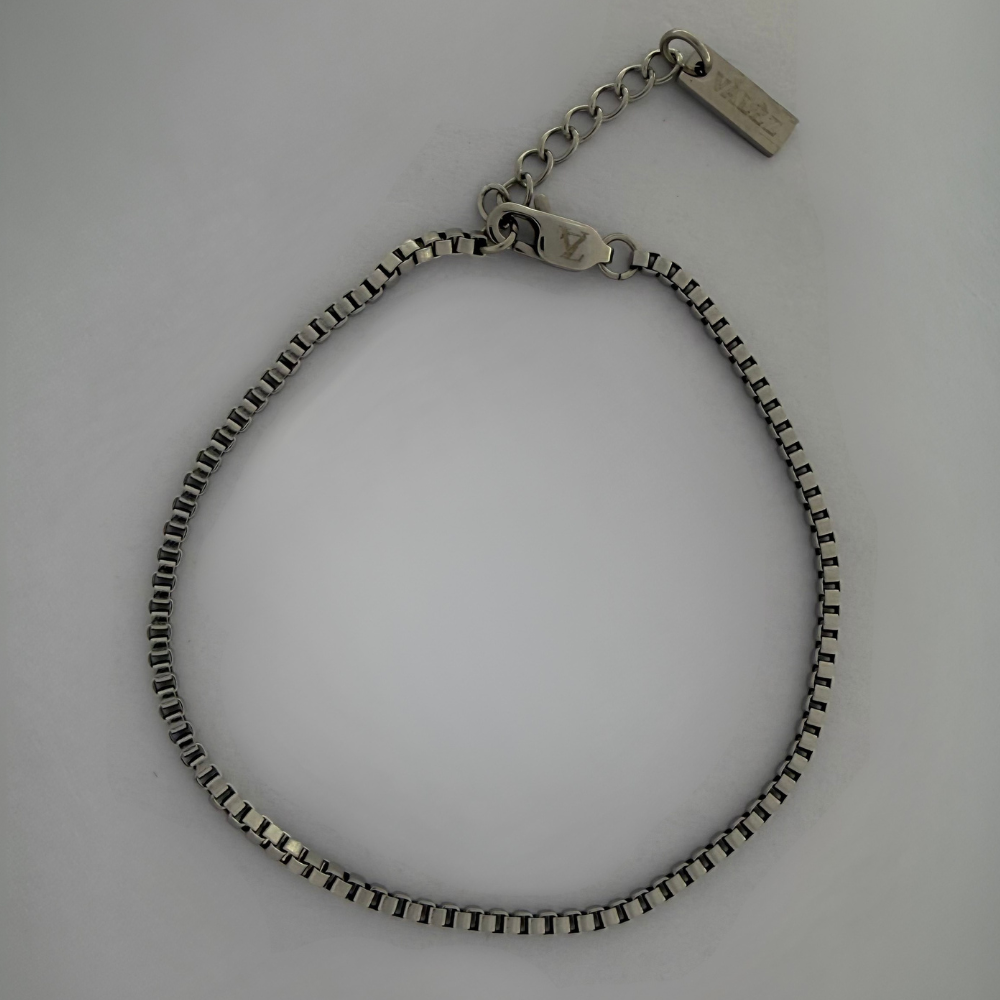 Stainless steel bracelet on a light gray background