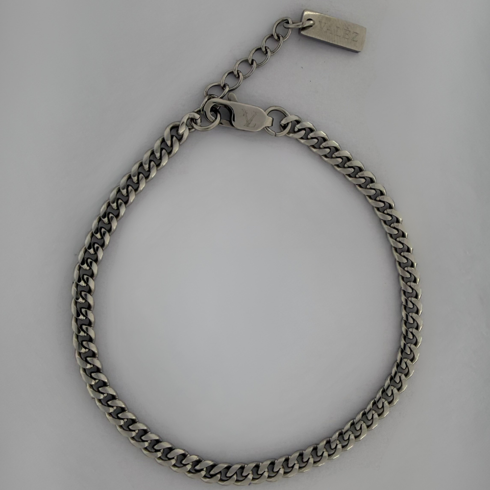 Stainless steel Cuban bracelet on a gray background