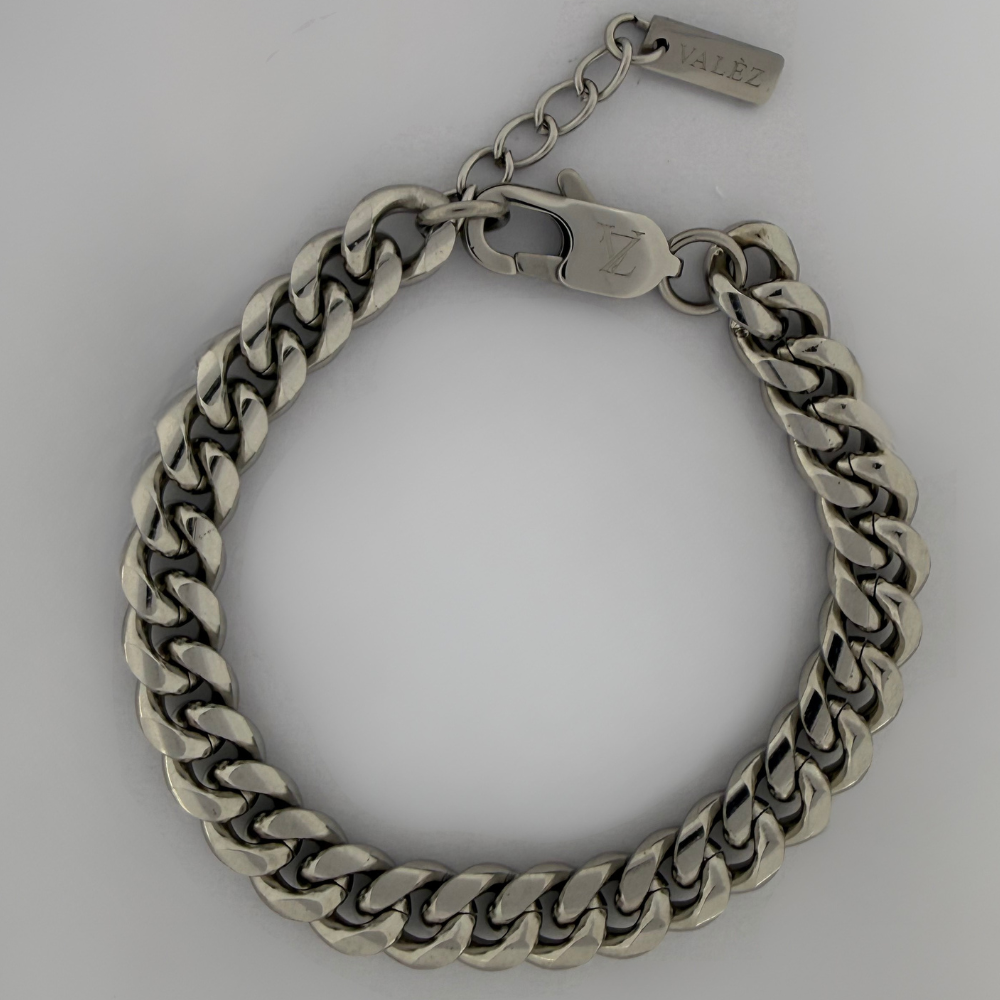 Stainless steel cuban bracelet on a light gray background