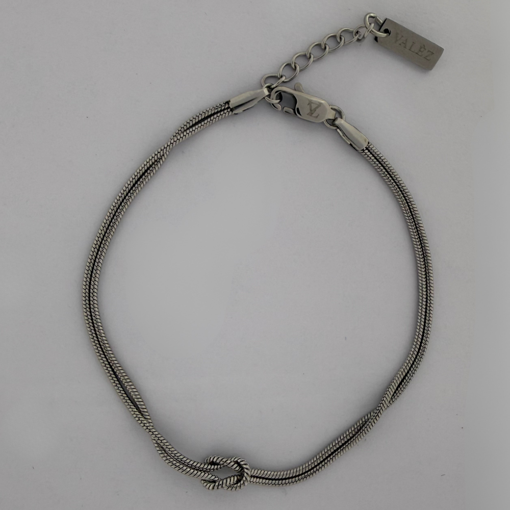 Stainless Steel Infinity bracelet on a light gray background