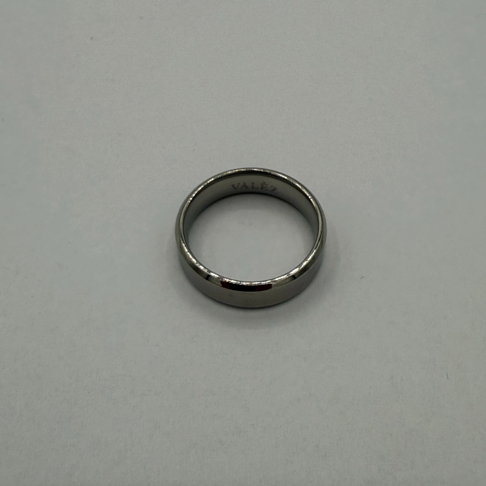 stainless steel ring on a gray background