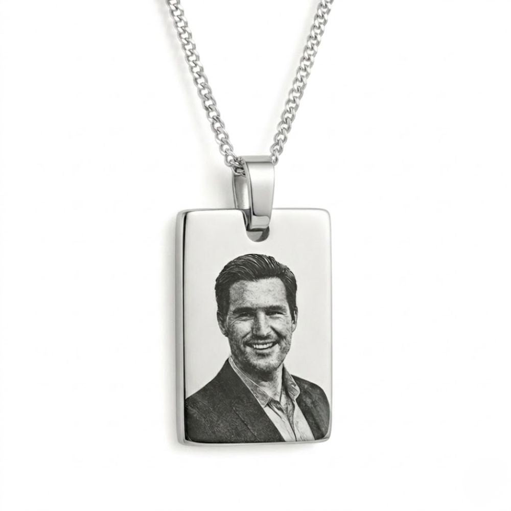 Rectangular pendant with engraved photo of a smiling man on a white background