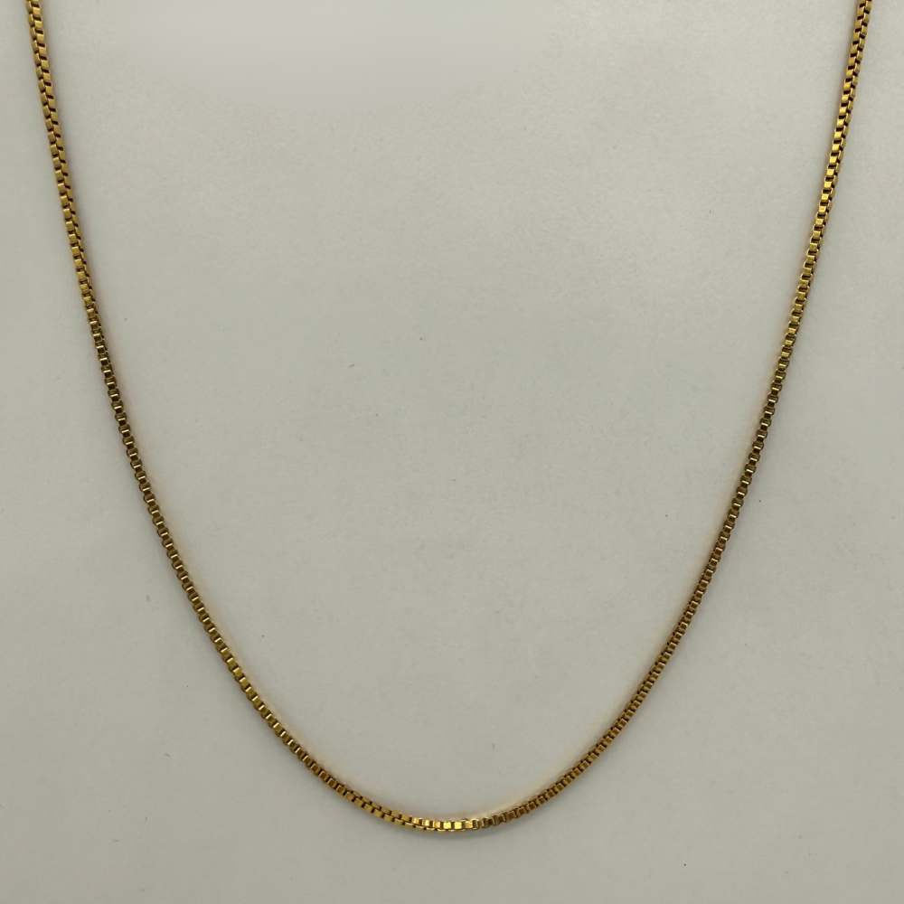 Gold Box chain Necklace on a light gray background