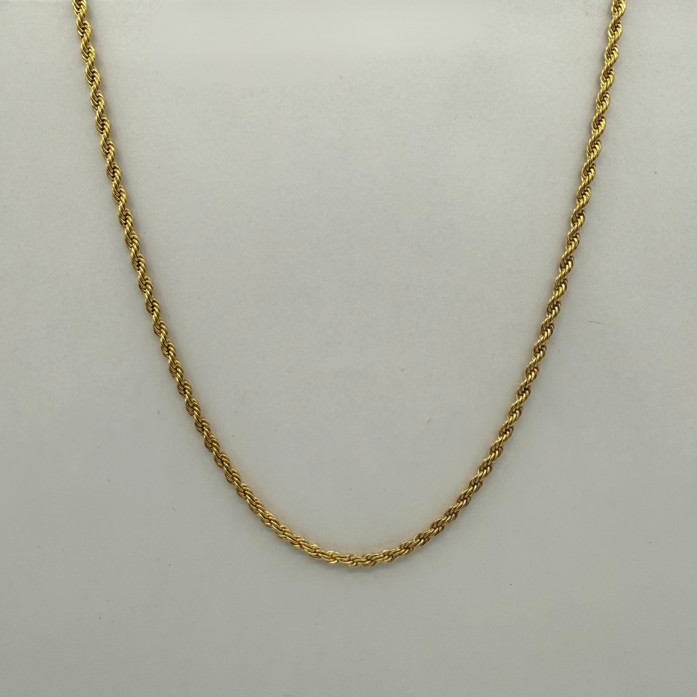 Gold rope chain necklace on a light gray background