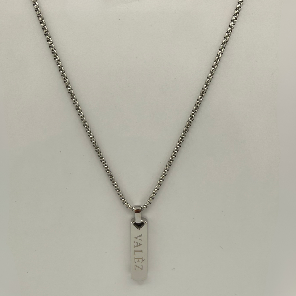 stainless steel necklace with a pendant on a light gray background